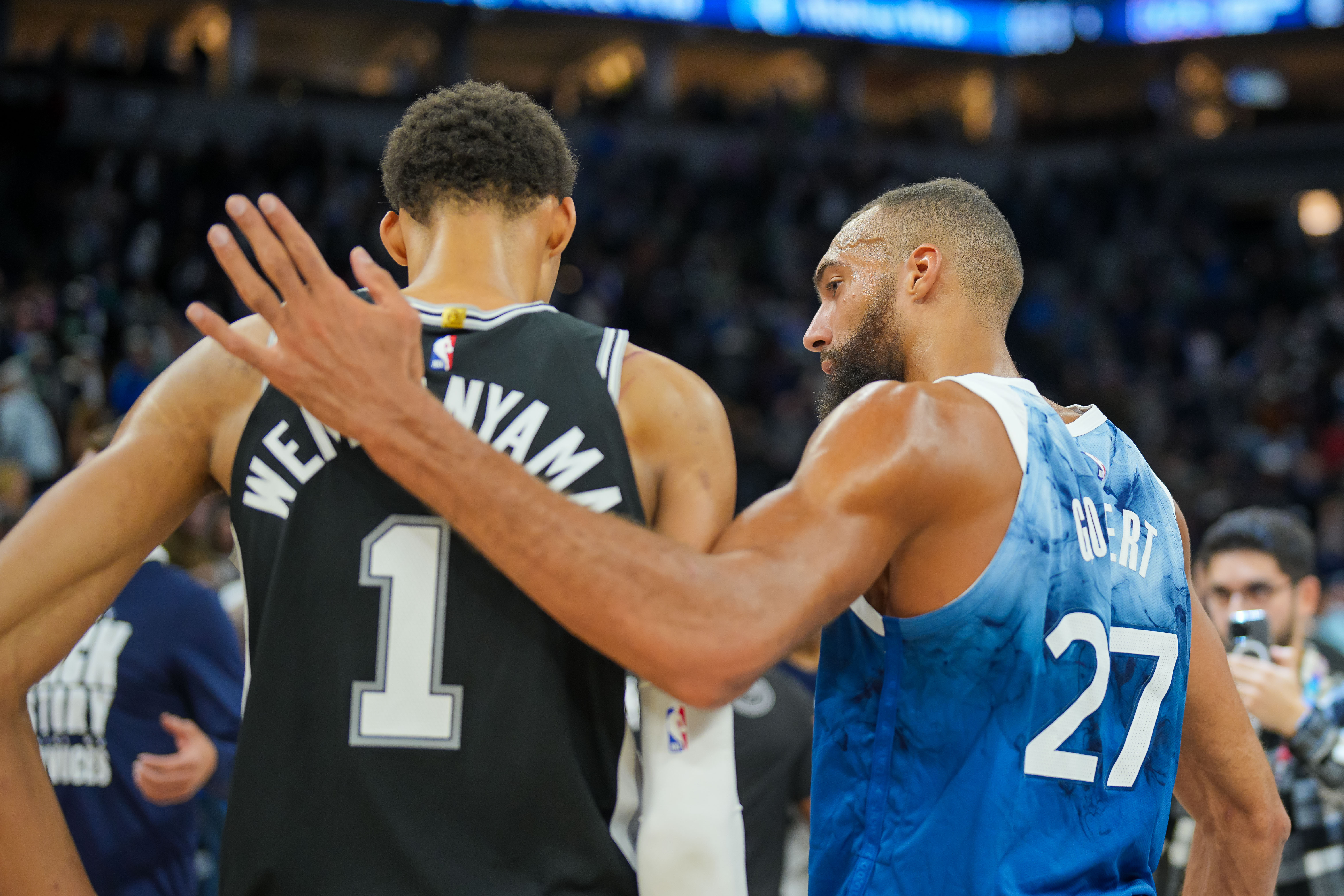 Feb 27, 2024; Minneapolis, Minnesota, USA; Minnesota Timberwolves center Rudy Gobert (27) and San Antonio Spurs center Victor Wembanyama (1) talk after the game at Target Center.